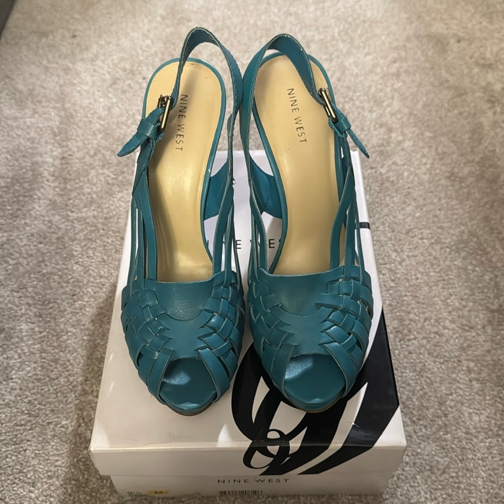 Like New leather peep toe  strapped, w/ wooden heels. Simply gorgeous!